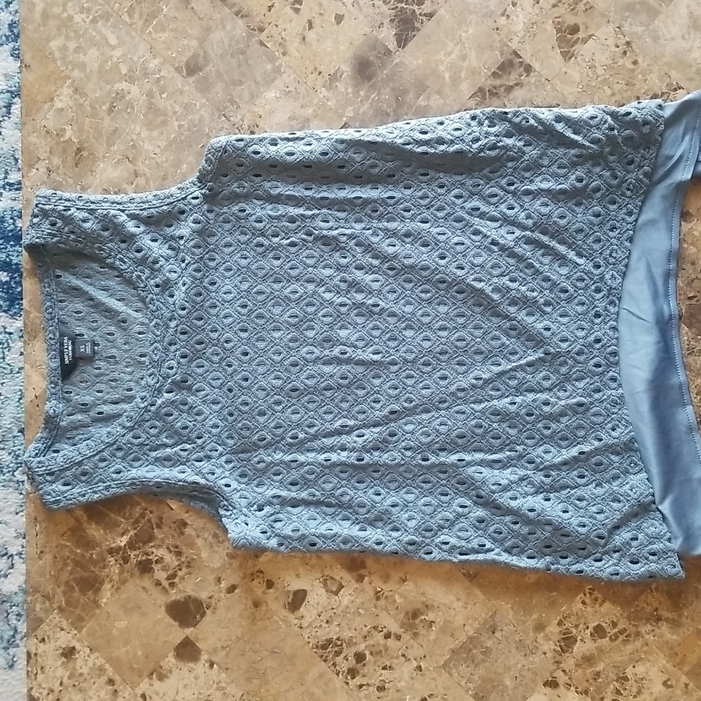Brand new, never worn, blueish tank top with silk underlay.